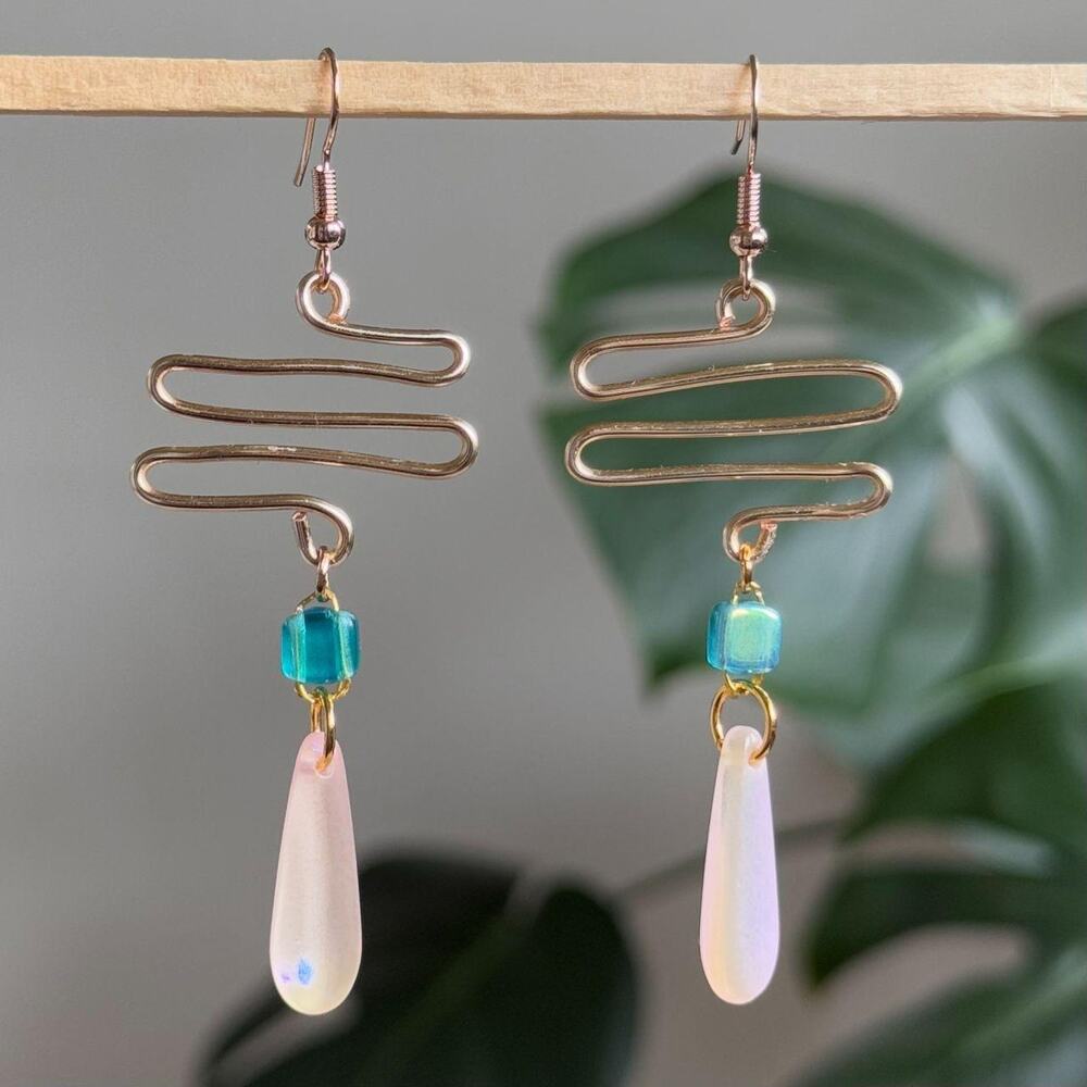 handmade gold wavy earrings with blue squares & light pink teardrop beads